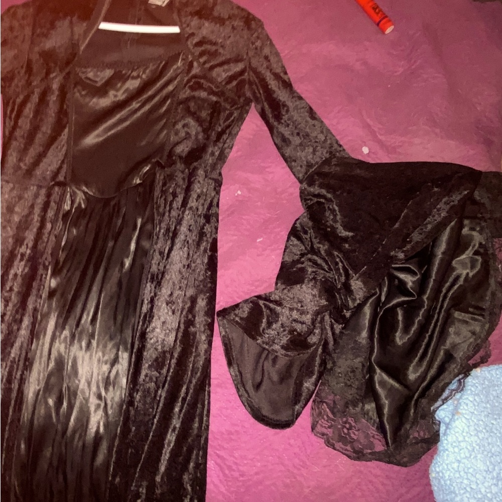 Long black dress with flowing sleeves